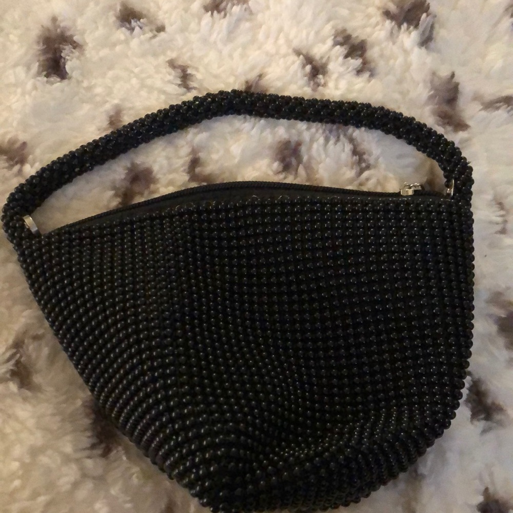 Elegant Black Beaded Women's Bag
Snaps together wristlet
